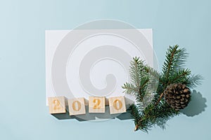 Happy new year composition. Paper sheet, 2020 number, fir branch with cone