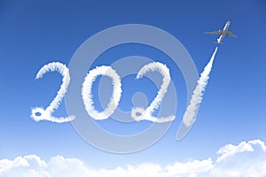 Happy New year 2021 concept. cloud drawing by airplane in sky