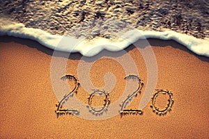 Happy New Year 2020 concept on the sea beach; sunrsie shot