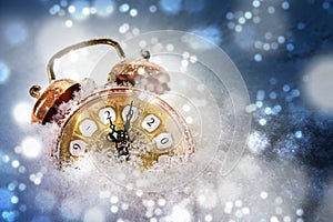 Happy New Year concept, vintage alarm clock in the snow shows 2020, greeting card with copy space