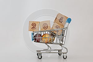 Happy new year concepts 2024, in a shopping trolley.