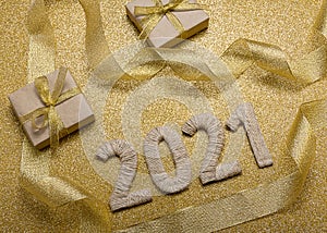 Happy New Year. Craft gifts and handcrafted lettering 2021 on gold background