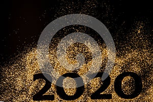 Happy New Year 2020. Creative Collage of numbers two and zero made up the year 2020. Beautiful sparkling Golden number 2020 on