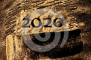 Happy New Year 2020. Creative Collage of numbers two and zero made up the year 2020. Beautiful sparkling Golden number 2020 on