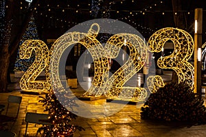 Happy New Year decorations with big numbers 2023. Festive city night illumination, Christmas celebration concept. New year 2023,