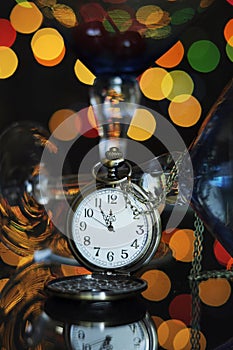 Happy New Year Eve party with pocket watch with five to midnight time