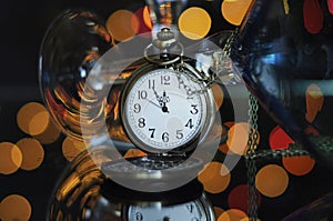 Happy New Year Eve party with pocket watch with five to midnight time