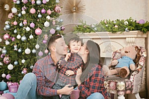 Happy new year family mother father child near christmas tree an