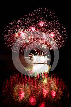 Happy New Year 2018 Firework. Beautiful colorful fireworks on the water surface with a clean black background.