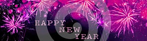 Happy new Year fireworks background banner panorama greeting card - Colorful abstract pink firework with bokeh lights in the dark