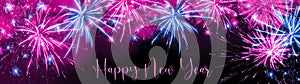 Happy new Year fireworks background banner panorama greeting card - Colorful abstract pink firework with bokeh lights in the dark