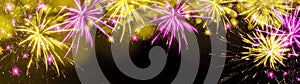 Happy new Year fireworks background banner panorama greeting card - Colorful abstract yellow firework with bokeh lights in the