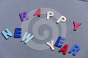 Happy new year font art colorful texting for greeting or celebrate card with gray background,