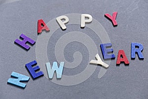 Happy new year font art colorful texting for greeting or celebrate card with gray background,