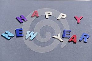 Happy new year font art colorful texting for greeting or celebrate card with gray background,