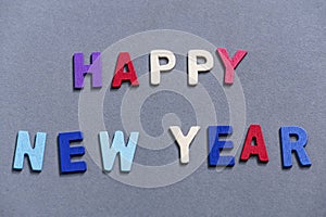 Happy new year font art colorful texting for greeting or celebrate card with gray background,