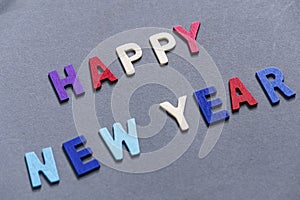 Happy new year font art colorful texting for greeting or celebrate card with gray background,