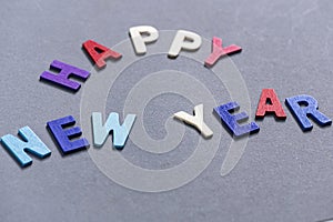 Happy new year font art colorful texting for greeting or celebrate card with gray background,