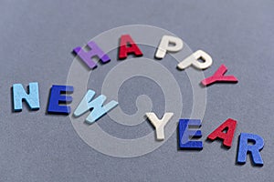 Happy new year font art colorful texting for greeting or celebrate card with gray background,