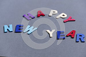 Happy new year font art colorful texting for greeting or celebrate card with gray background,