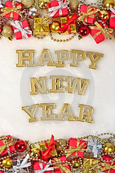 Happy New Year golden text and Christmas decorations on a white