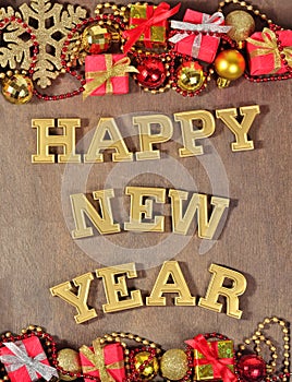 Happy New Year golden text and Christmas decorations