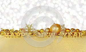 Happy New Year golden text and golden Christmas decorations