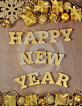 Happy New Year golden text and golden Christmas decorations