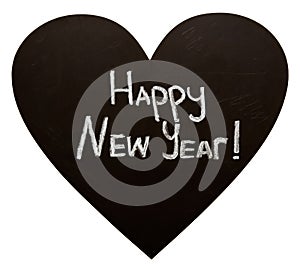Happy New Year on heart shape blackboard