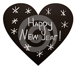 Happy New Year on heart shape blackboard