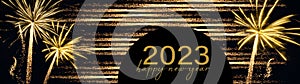 2023 Happy New Year holiday Greeting Card banner panorama - Golden year, glitter stripes and firework fireworks pyrotechnics on