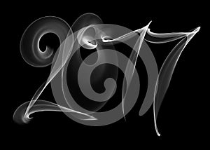 Happy new year 2017 isolated numbers lettering written with white fire flame or smoke on black background