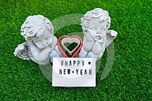 Happy new year lable with Cupid dolls lover