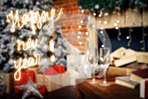 Happy New Year lettering with sparklers on background two glasses with champagne on the table against of New Year decorations and