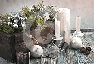 Happy New year and merry Christmas, atmospheric Christmas background in retro style with candles and pine branches on a