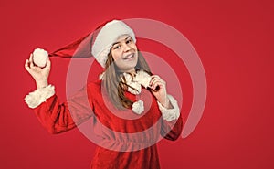 happy new year. merry christmas. cheerful teen girl celebrate xmas party. kid wear red santa claus hat. child santa