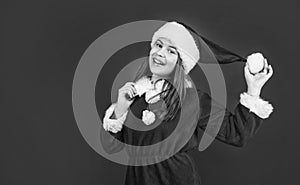 happy new year. merry christmas. cheerful teen girl celebrate xmas party. kid wear red santa claus hat. child santa