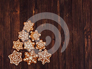 Happy New Year and Merry Christmas gingerbread on wood background. Christmas baking. Making gingerbread christmas cookies. Christm