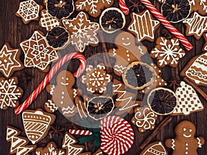 Happy New Year and Merry Christmas gingerbread on wood background. Christmas baking. Making gingerbread christmas cookies. Christm photo