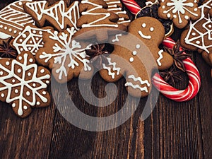Happy New Year and Merry Christmas gingerbread on wood background. Christmas baking. Making gingerbread christmas cookies. Christm photo