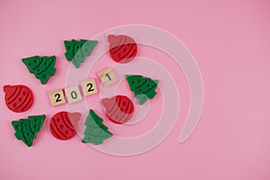 Happy New Year and Merry Christmas. Scrabble letters, playdough and plasticine. Letter tiles spelling celebration holiday