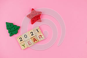 Happy New Year and Merry Christmas. Scrabble letters, playdough and plasticine. Letter tiles spelling celebration holiday