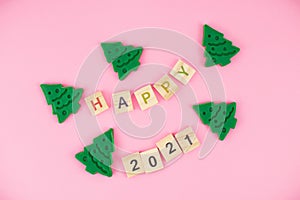 Happy New Year and Merry Christmas. Scrabble letters, playdough and plasticine. Letter tiles spelling celebration holiday