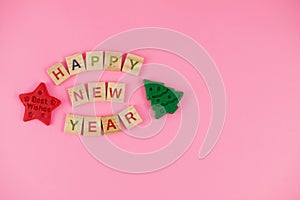 Happy New Year and Merry Christmas. Scrabble letters, playdough and plasticine. Letter tiles spelling celebration holiday