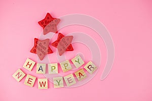 Happy New Year and Merry Christmas. Scrabble letters, playdough and plasticine. Letter tiles spelling celebration holiday