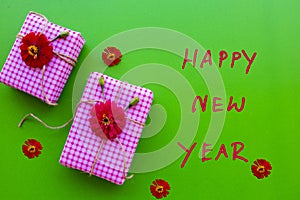 Happy new year message card handwriting with gift box arrangement flat lay style