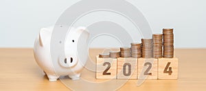 Happy New Year with piggy bank and flipping 2023 change to 2024 block. Resolution, Goals, Plan, Action, Money Saving, Retirement