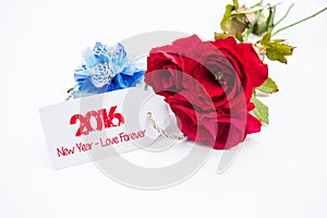 Happy new year 2016 with rose and tag isolated on a white background