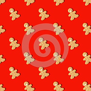 Happy New Year`s 2022 banner gingerbread man in face mask from ginger biscuits on classic traditional red background, minimal sea