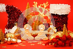 Happy New Year`s 2022, Christmas set of gingerbread man and woman in face mask and red gold decorations on classic traditional re